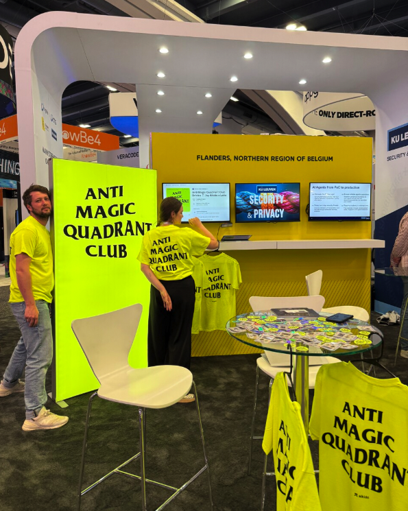 Aikido's 2025 RSAC decoy booth: highlighter-yellow Anti Magic Quadrant Club stand with crew in matching neon yellow shirts.